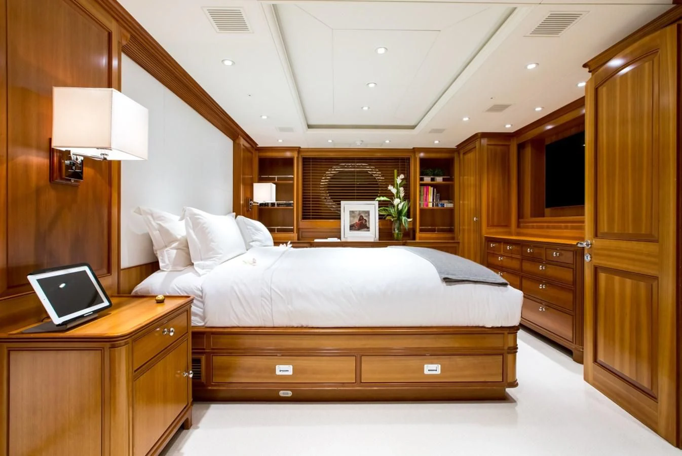 a bedroom with a laptop on the bed aboard PERSEUS Yacht for Sale