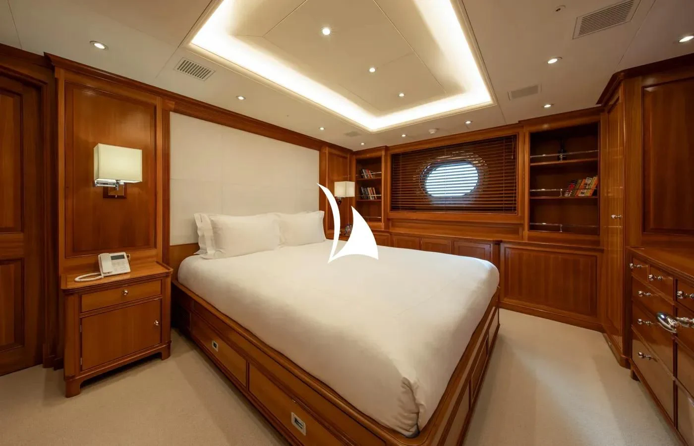 a room with a bed and a desk aboard PERSEUS Yacht for Sale