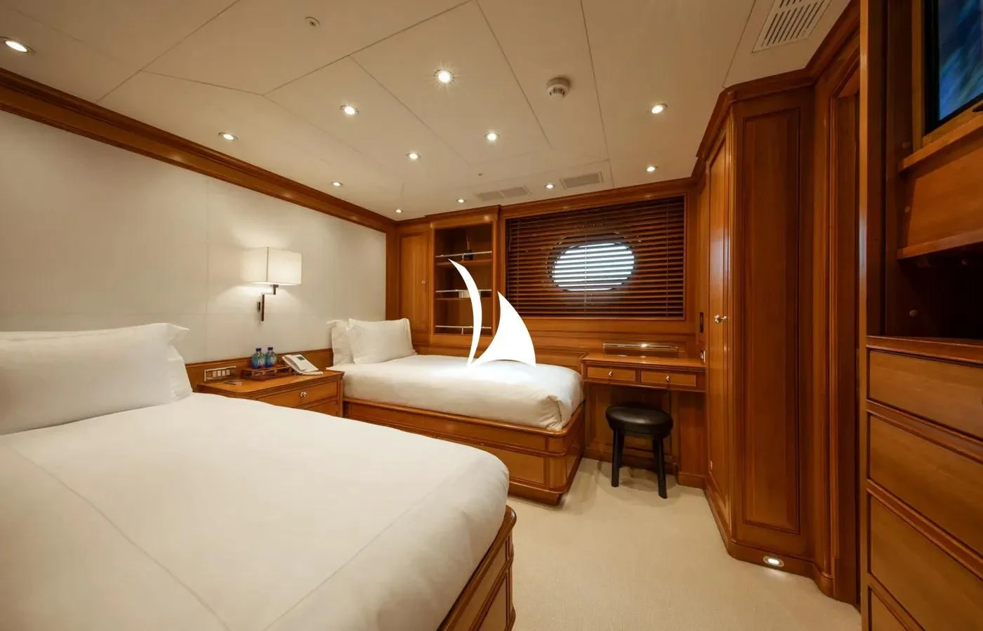 a room with a bed and a desk aboard PERSEUS Yacht for Sale
