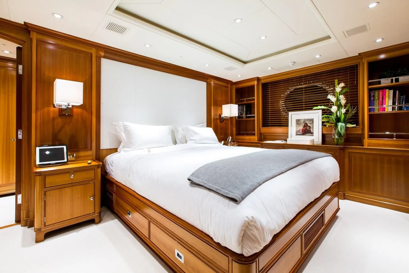 a bedroom with a bed and a desk aboard PERSEUS Yacht for Sale
