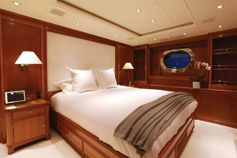 a hotel room with a bed and a tv aboard PERSEUS Yacht for Sale