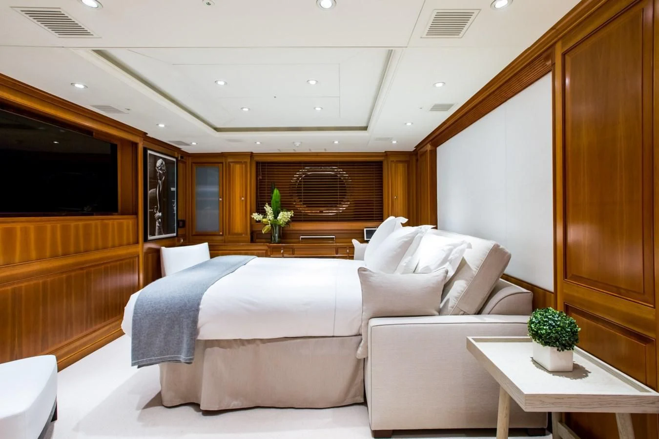 a room with a bed and a table aboard PERSEUS Yacht for Sale
