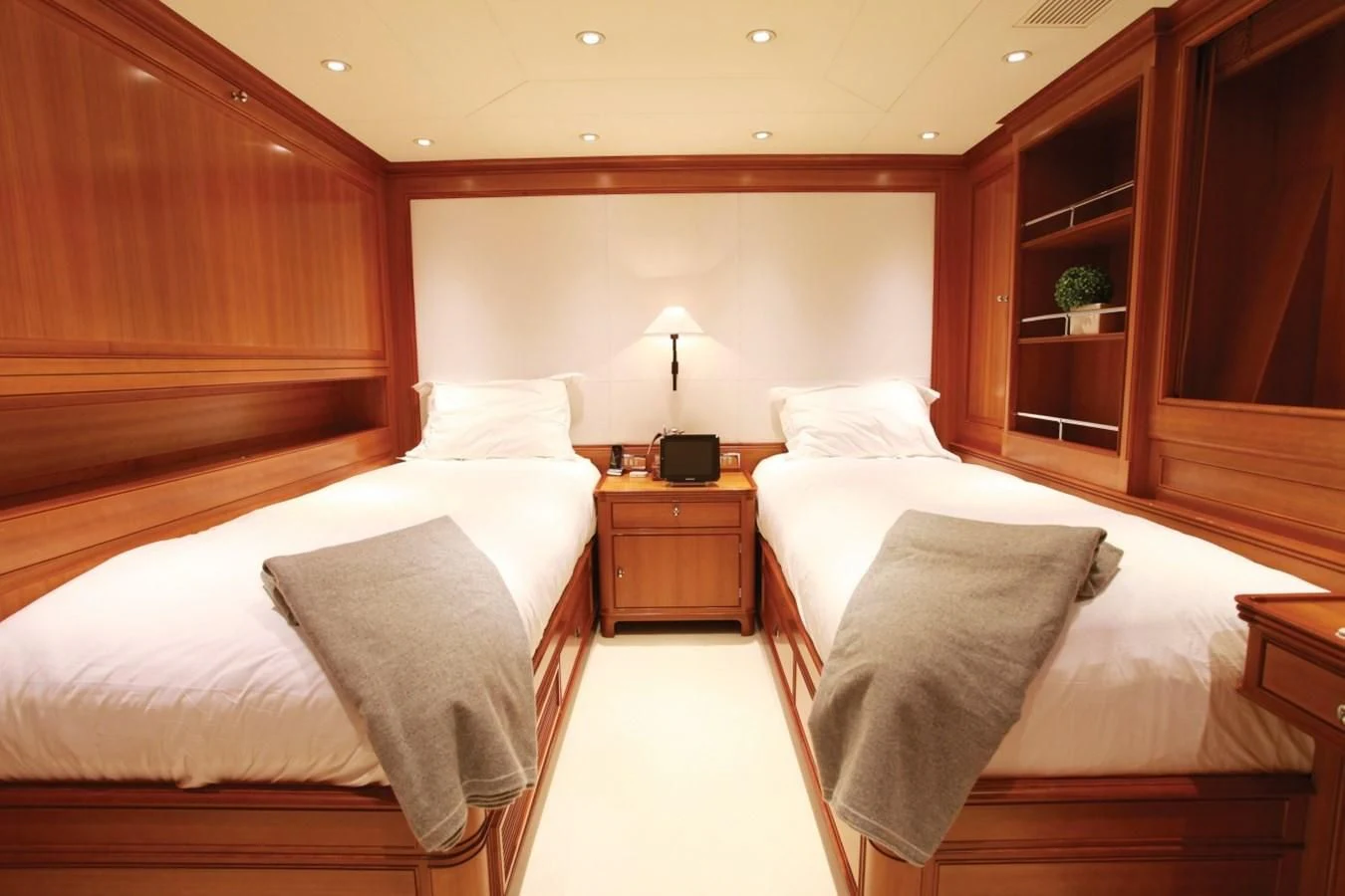 a room with a bed and a desk aboard PERSEUS Yacht for Sale