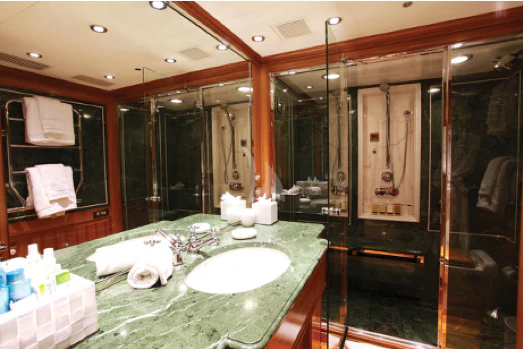 a bathroom with a large mirror aboard PERSEUS Yacht for Sale