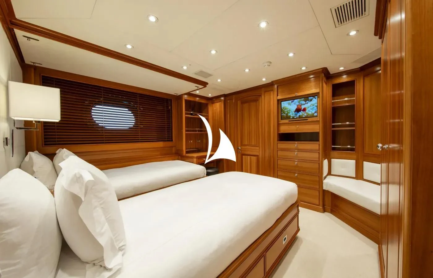 a room with a bed and a television aboard PERSEUS Yacht for Sale