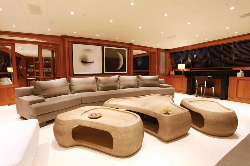 a living room with a couch and a coffee table aboard PERSEUS Yacht for Sale