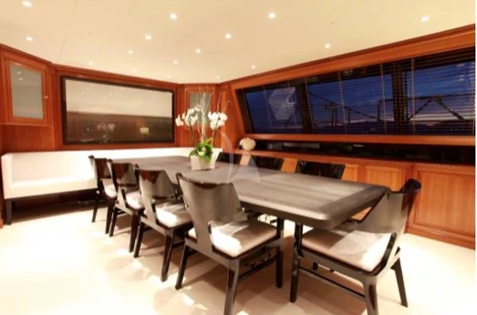 a room with a table and chairs aboard PERSEUS Yacht for Sale