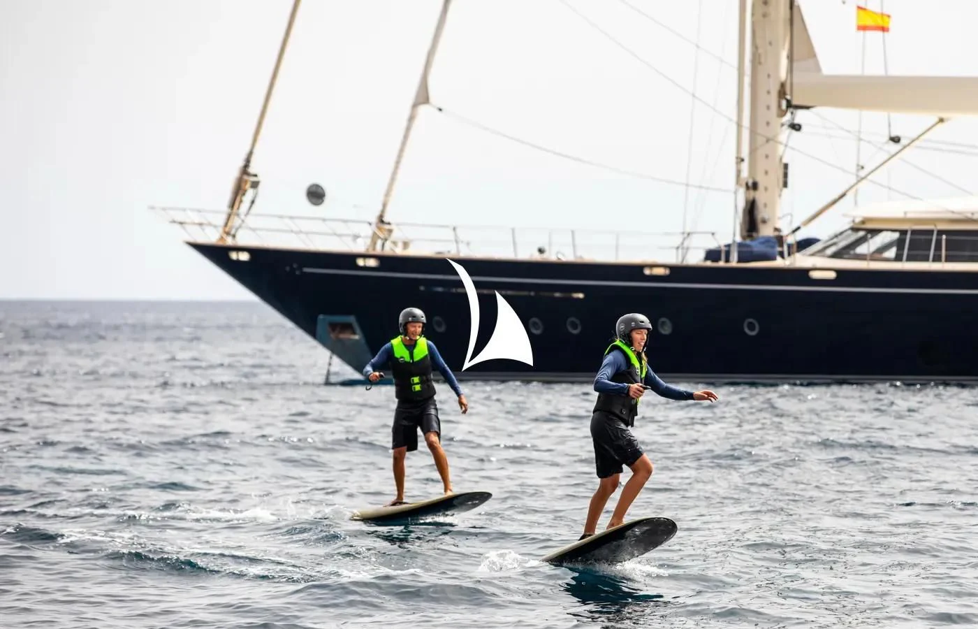 a couple of people on surfboards in the water aboard PERSEUS Yacht for Sale