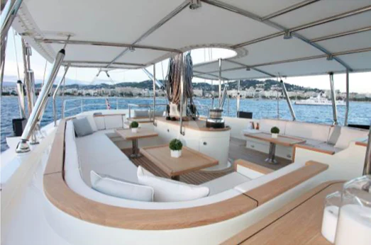 a lounge area with a large body of water in the background aboard PERSEUS Yacht for Sale