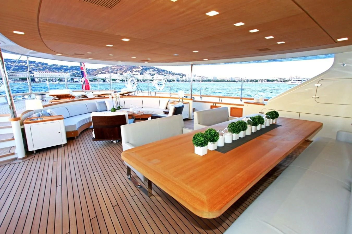 a large room with a table and chairs aboard PERSEUS Yacht for Sale