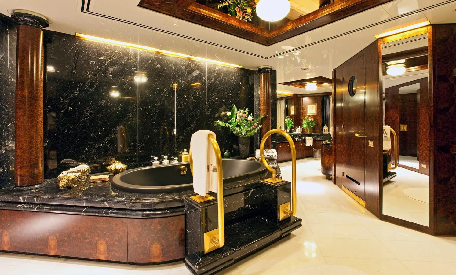 a large bathroom with a large black mirror aboard LADY MOURA Yacht for Sale