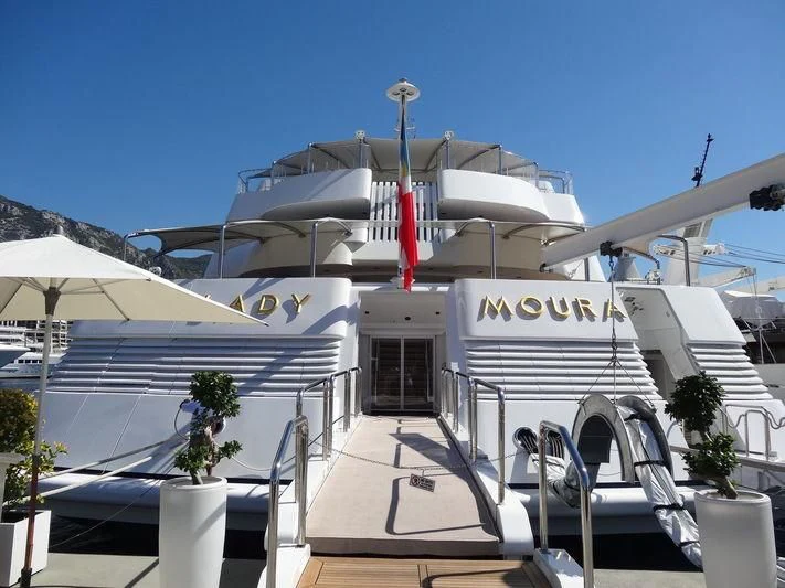 a boat docked at a pier aboard LADY MOURA Yacht for Sale