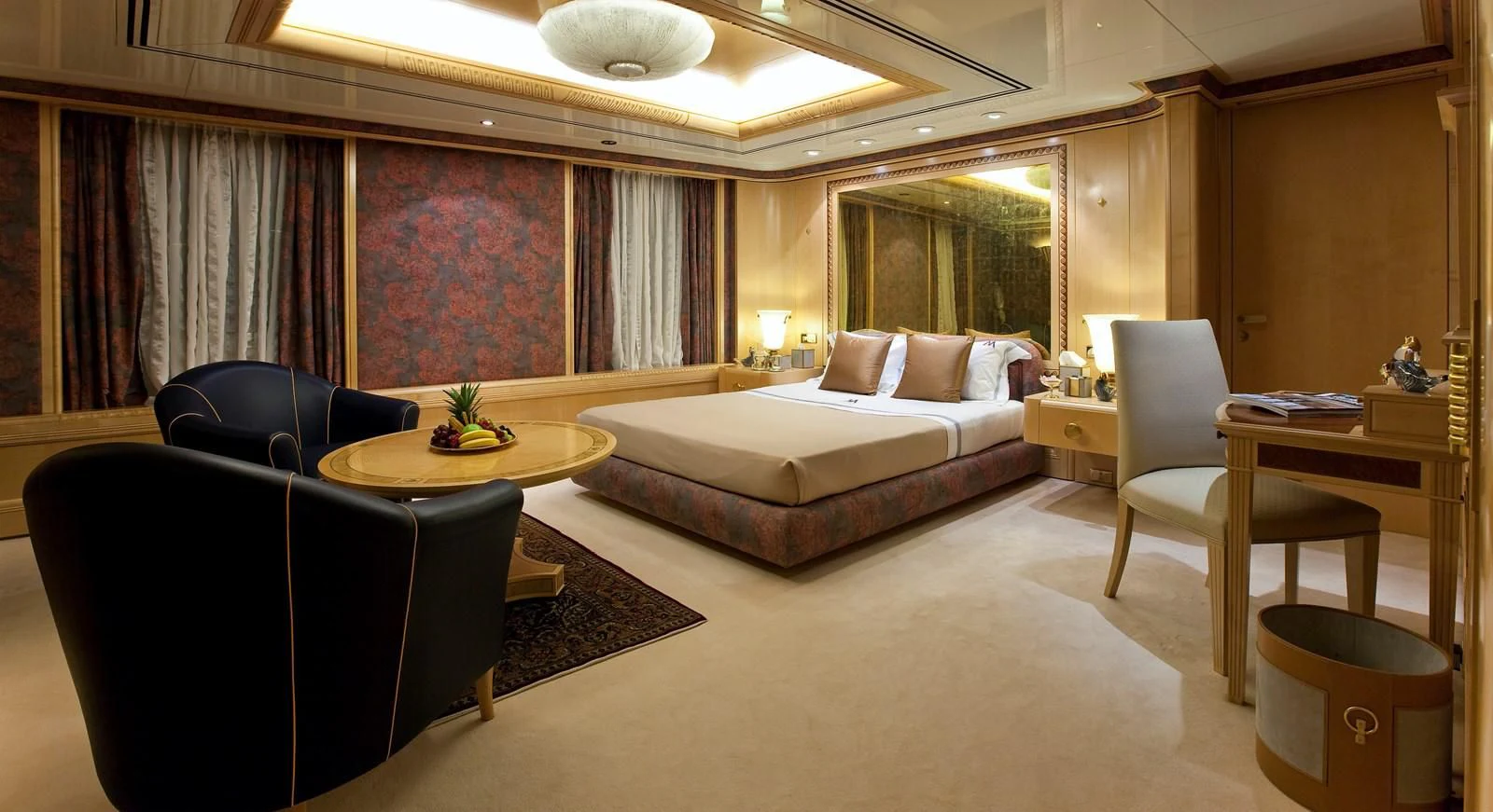 a room with a bed and a chair aboard LADY MOURA Yacht for Sale