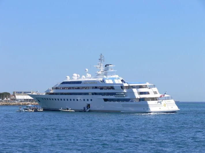 a large white ship in the water aboard LADY MOURA Yacht for Sale