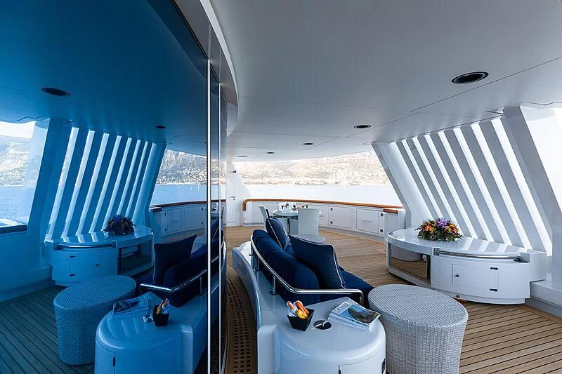 a room with a bed and a chair aboard LADY MOURA Yacht for Sale