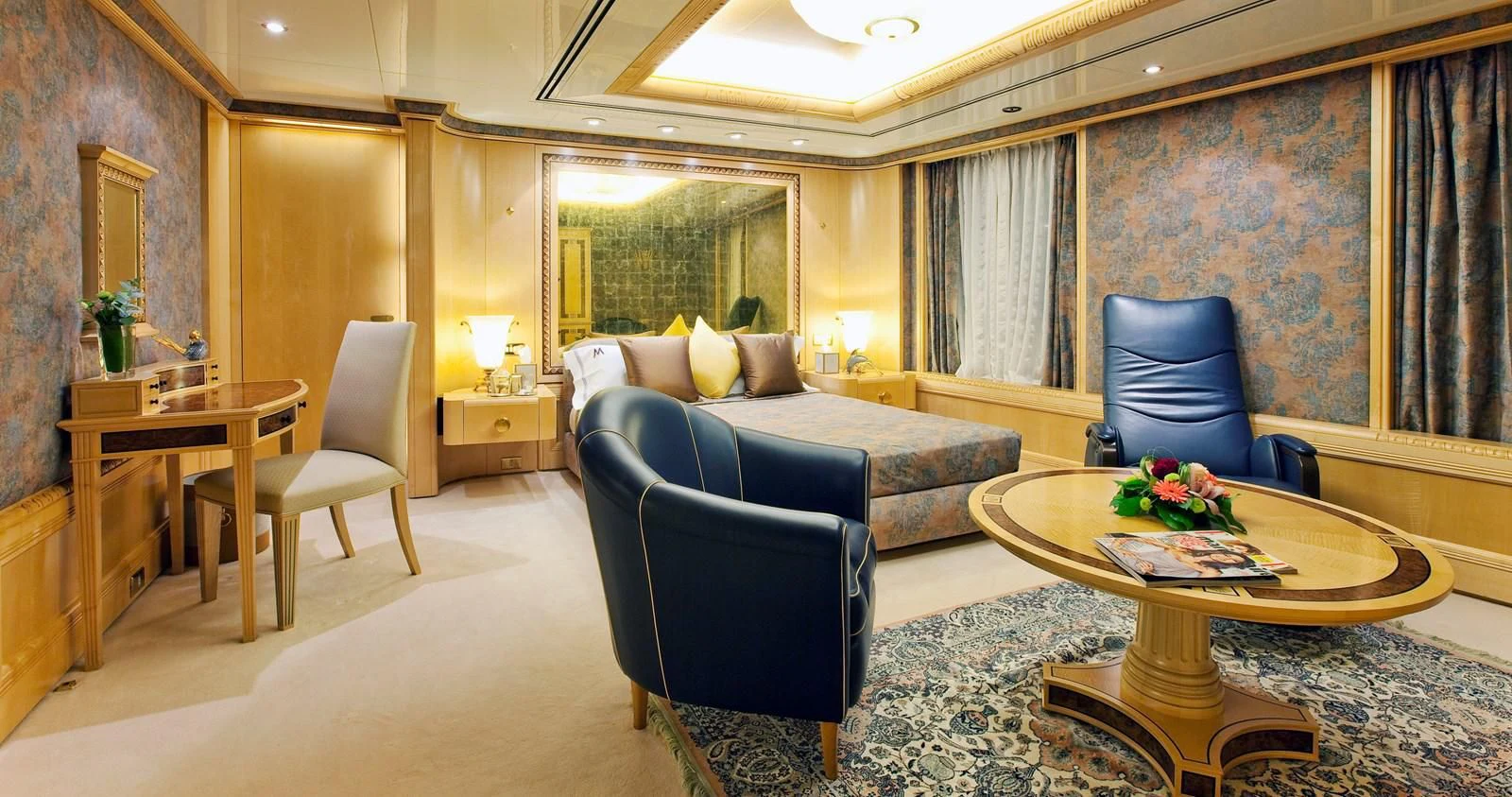 a living room with a couch and a coffee table aboard LADY MOURA Yacht for Sale