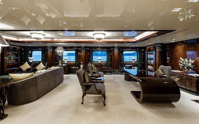 a room with couches and a television aboard LADY MOURA Yacht for Sale