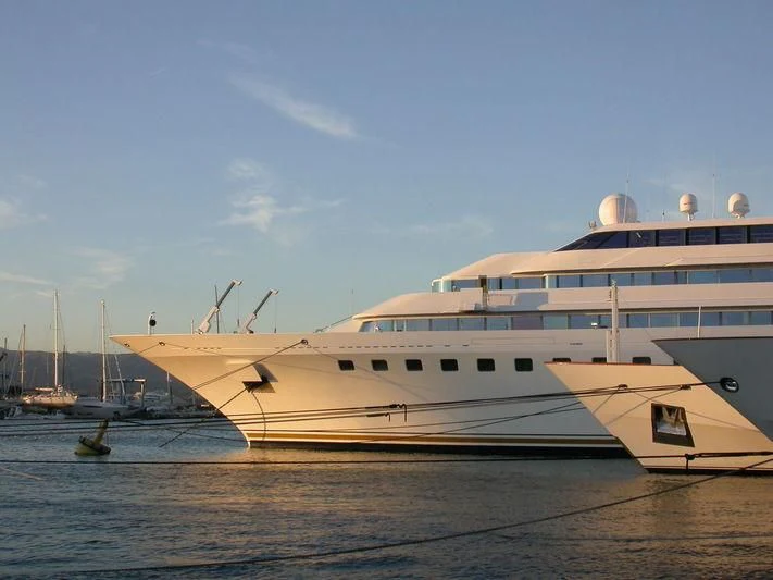 a large cruise ship docked aboard LADY MOURA Yacht for Sale