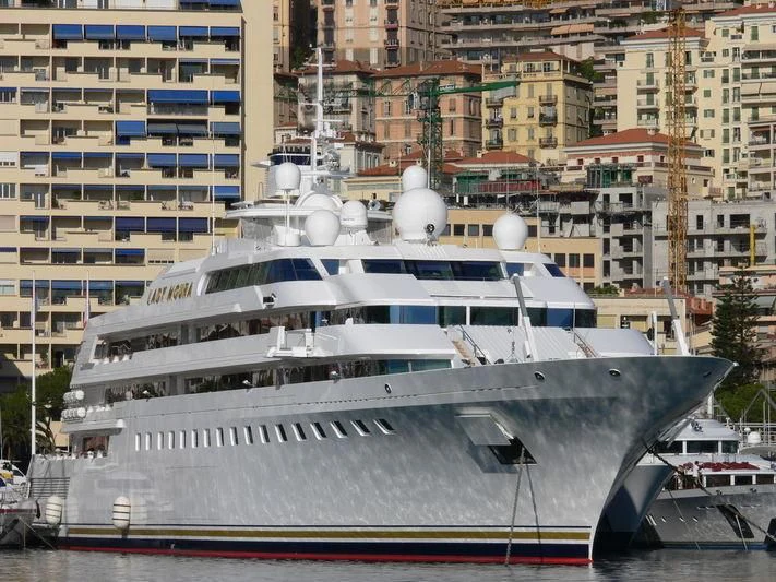 a large yacht in the harbor aboard LADY MOURA Yacht for Sale