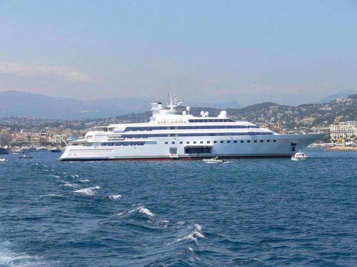 a large white ship in the water aboard LADY MOURA Yacht for Sale
