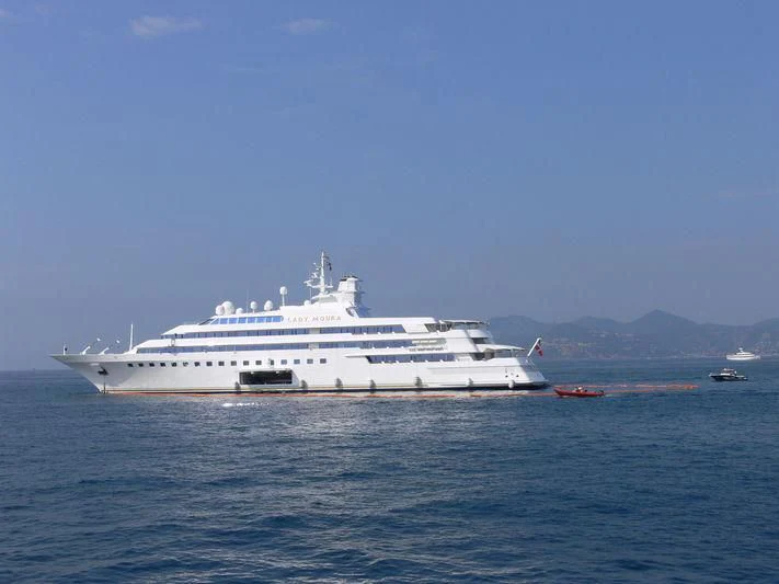 a large white ship in the water aboard LADY MOURA Yacht for Sale