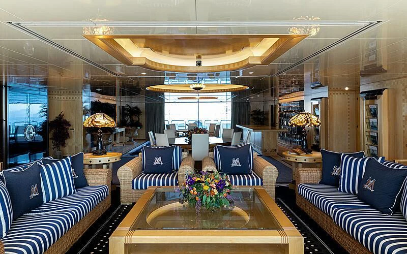 a room with a table chairs and a large window aboard LADY MOURA Yacht for Sale