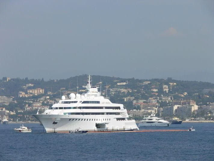 a large white ship in the water aboard LADY MOURA Yacht for Sale