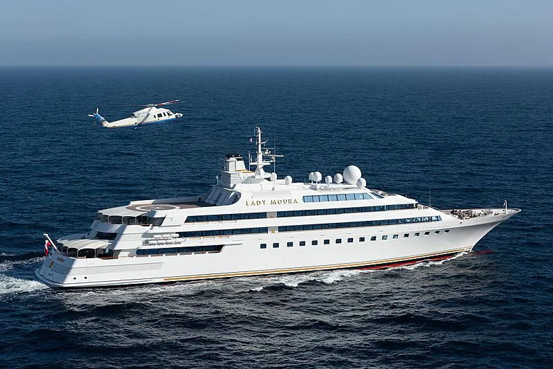 a large white yacht with a white boat in the water aboard LADY MOURA Yacht for Sale