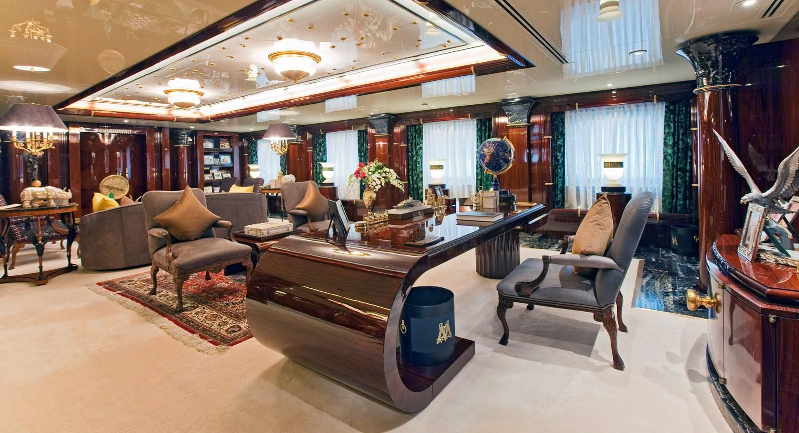a large room with a table and chairs aboard LADY MOURA Yacht for Sale