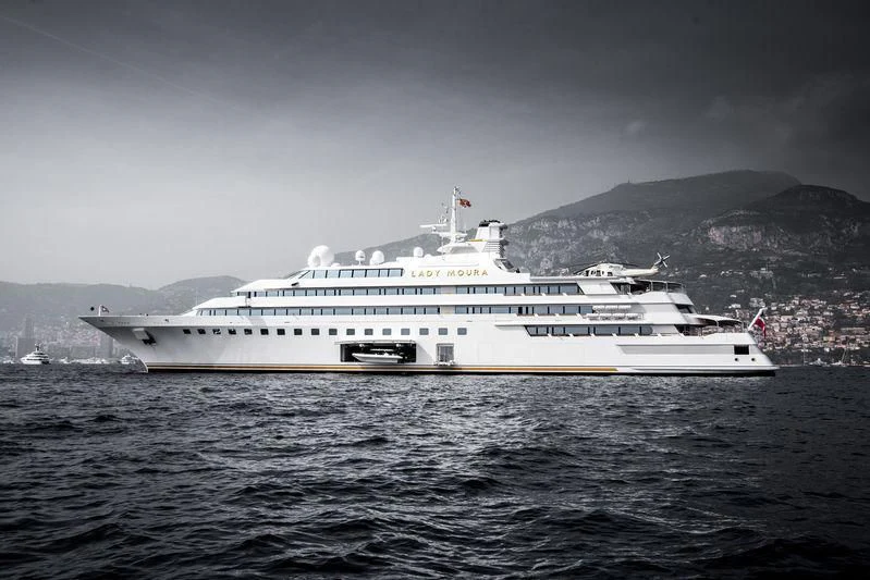 a large white ship in the water aboard LADY MOURA Yacht for Sale
