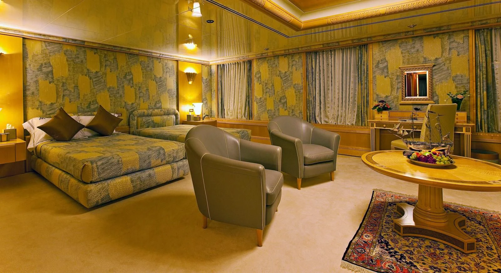 a large living room with a couch and a table aboard LADY MOURA Yacht for Sale