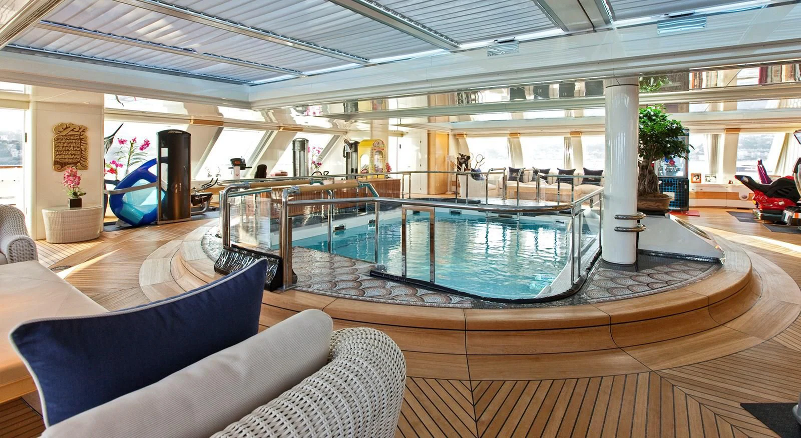 a large swimming pool in a room aboard LADY MOURA Yacht for Sale