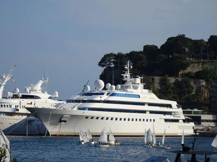 a large white yacht aboard LADY MOURA Yacht for Sale