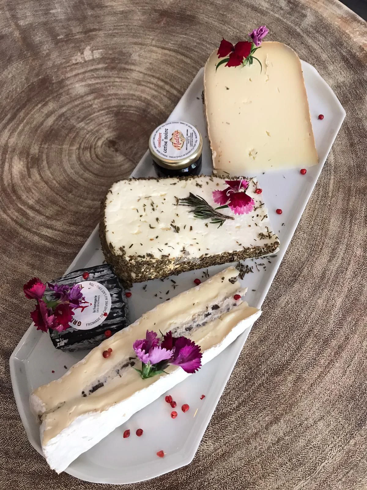 a cake with white frosting and chocolate bars on it aboard EPIC Yacht for Sale