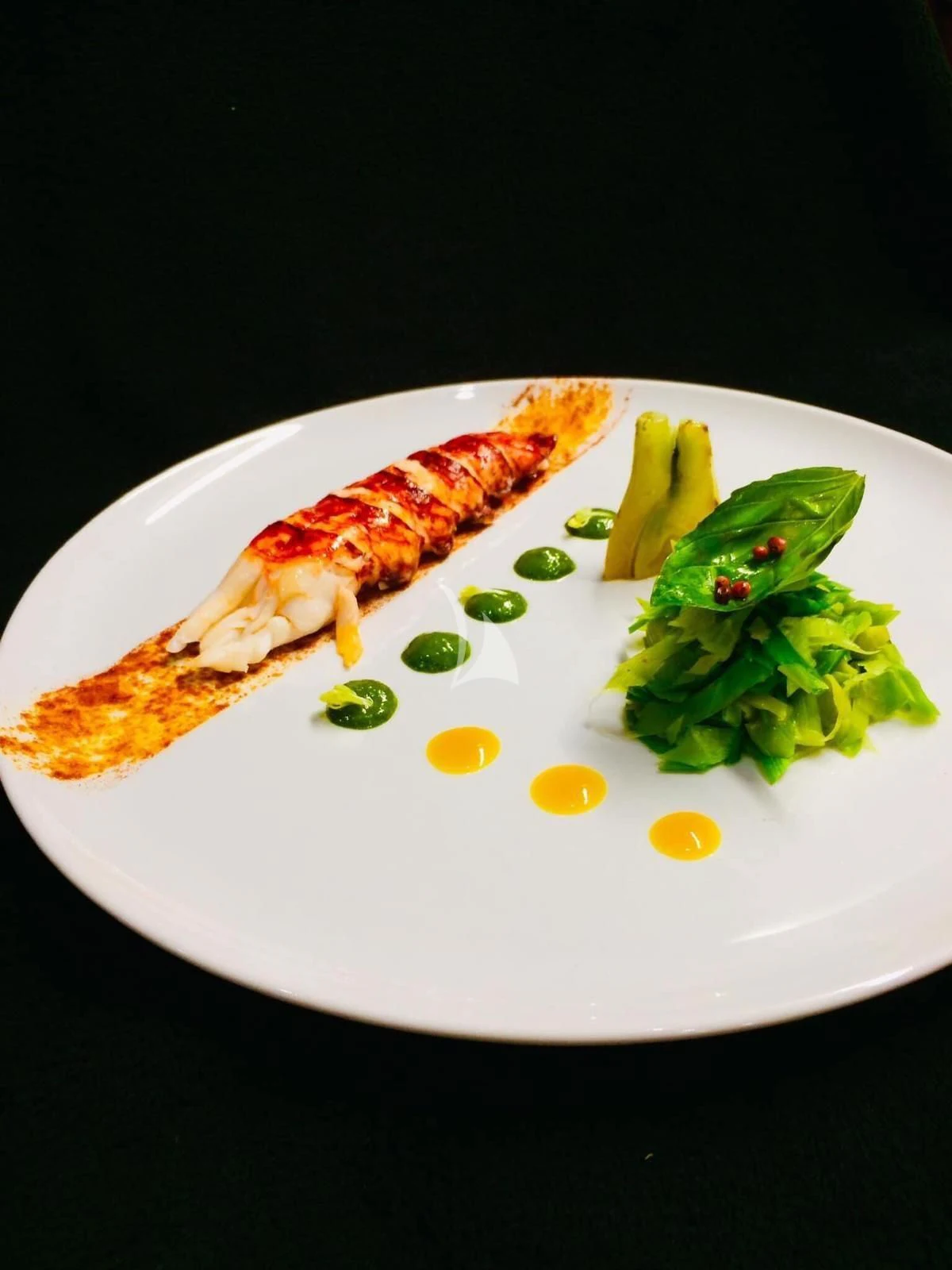 a plate of food aboard EPIC Yacht for Sale