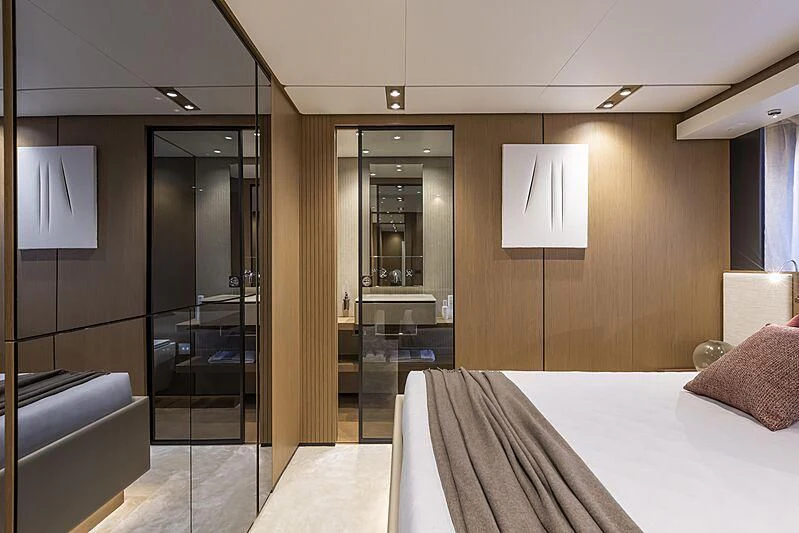 a hotel room with a glass door aboard EPIC Yacht for Sale