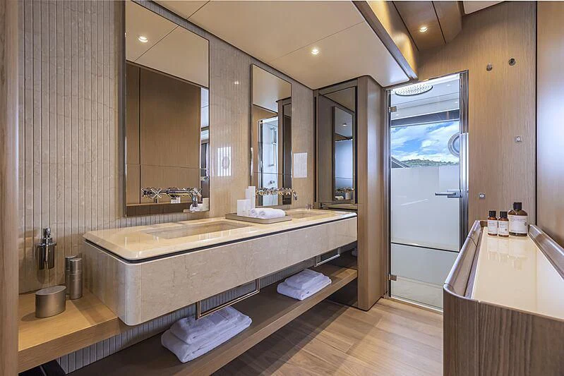 a bathroom with a large mirror aboard EPIC Yacht for Sale