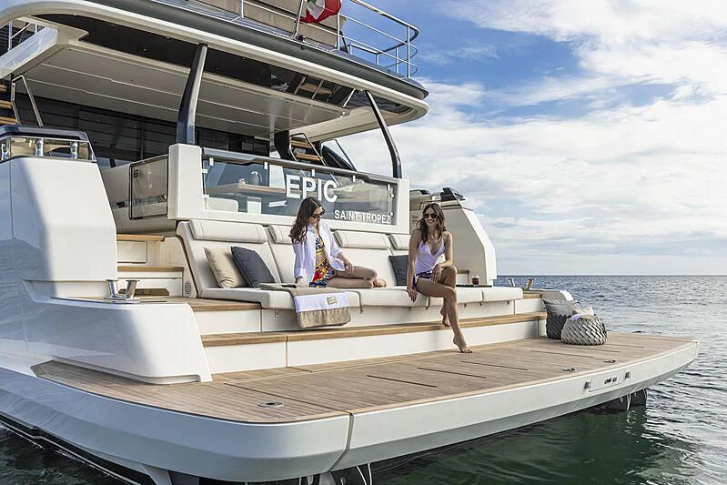 a couple of women sitting on a boat aboard EPIC Yacht for Sale