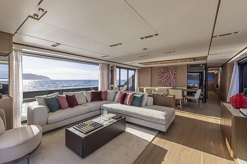 a living room with a large window aboard EPIC Yacht for Sale