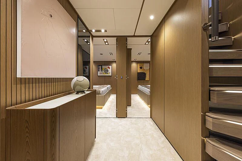 a hallway with a large mirror aboard EPIC Yacht for Sale