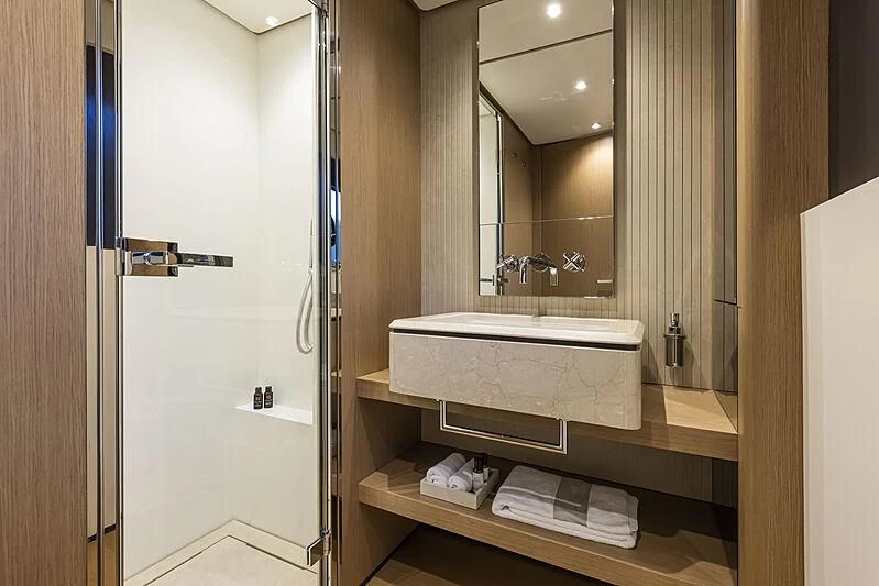 a bathroom with a large mirror aboard EPIC Yacht for Sale