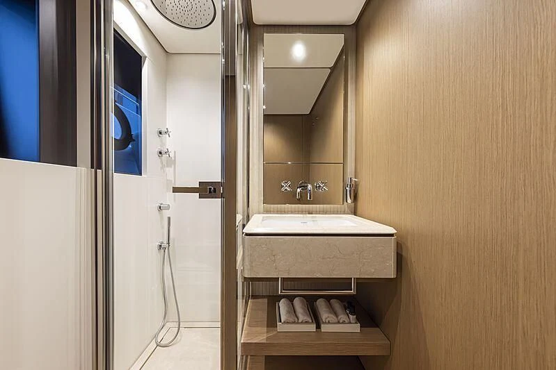 a bathroom with a sink and a mirror aboard EPIC Yacht for Sale