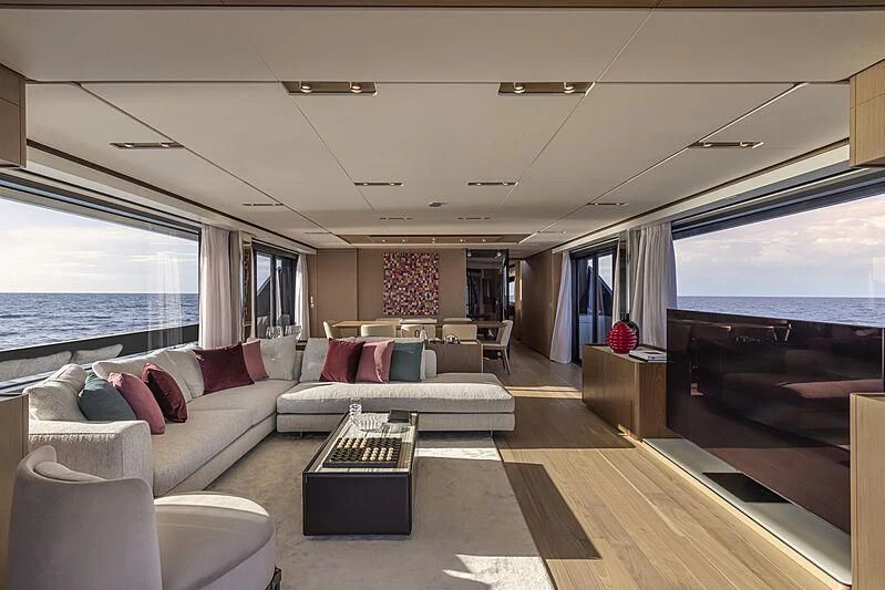 a living room with a large window aboard EPIC Yacht for Sale