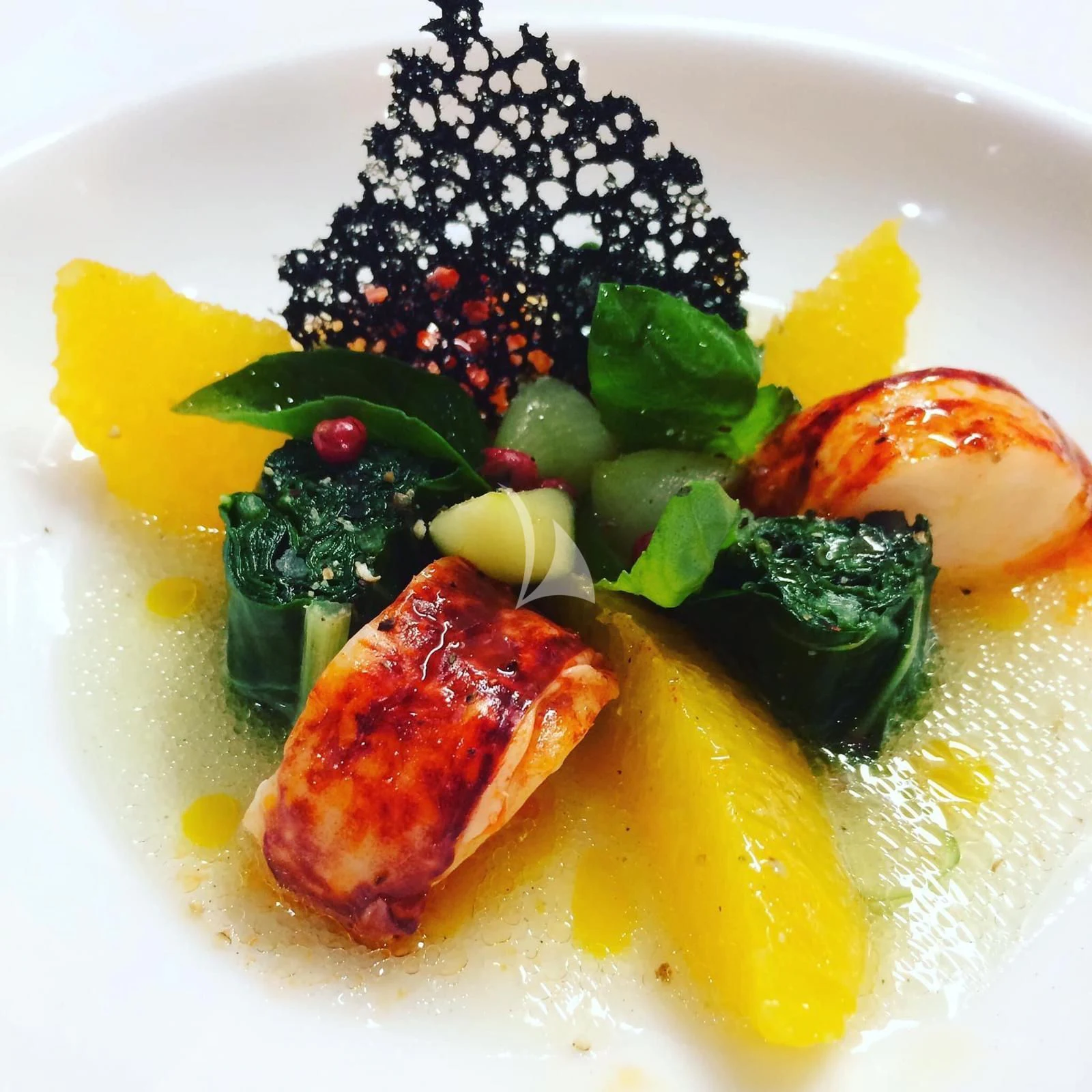 a plate of food aboard EPIC Yacht for Sale