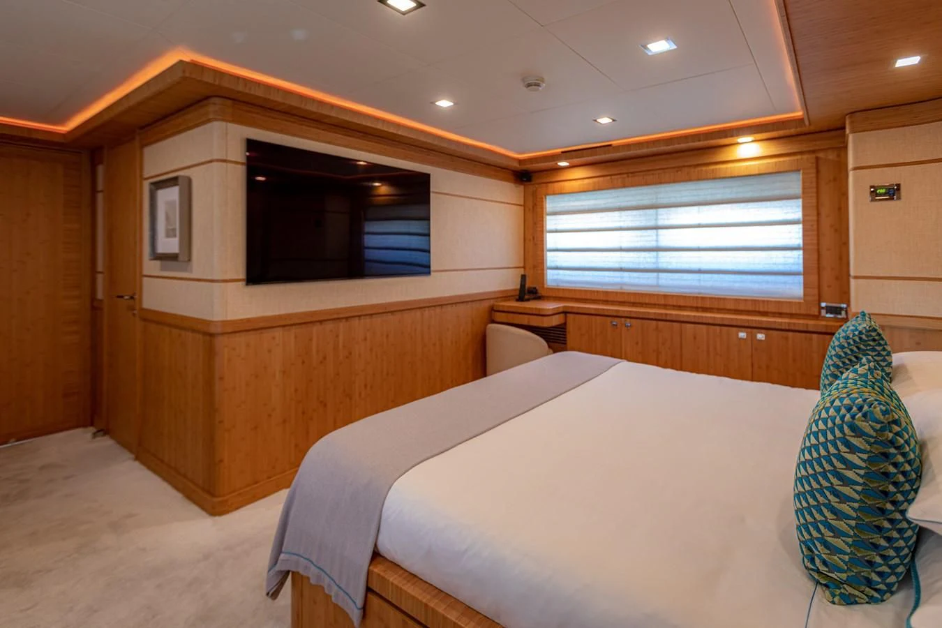 a room with a bed and a television aboard MARIDAKI Yacht for Sale