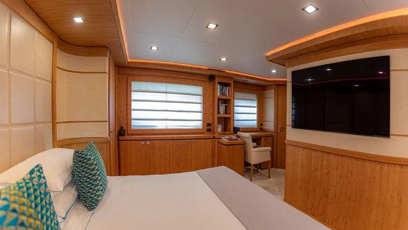 a room with a bed and a television aboard MARIDAKI Yacht for Sale