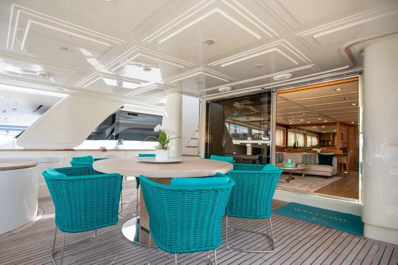 a room with a table and chairs aboard MARIDAKI Yacht for Sale