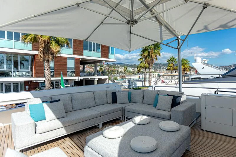 a patio with a couch and a pool aboard MARIDAKI Yacht for Sale