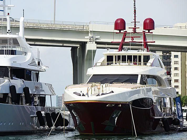 a boat docked at a pier aboard CABERNET Yacht for Sale