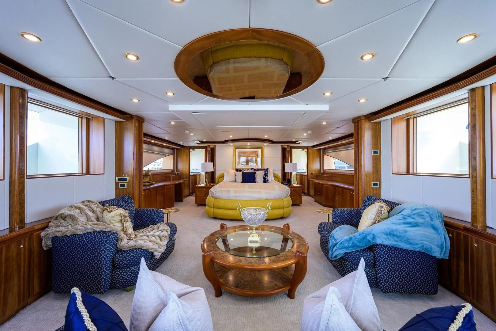 a living room with a large chandelier aboard CABERNET Yacht for Sale